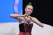 Sofia Kuryachenko after an exercise with a hoop