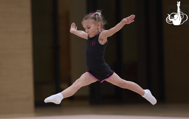 Young gymnast during training