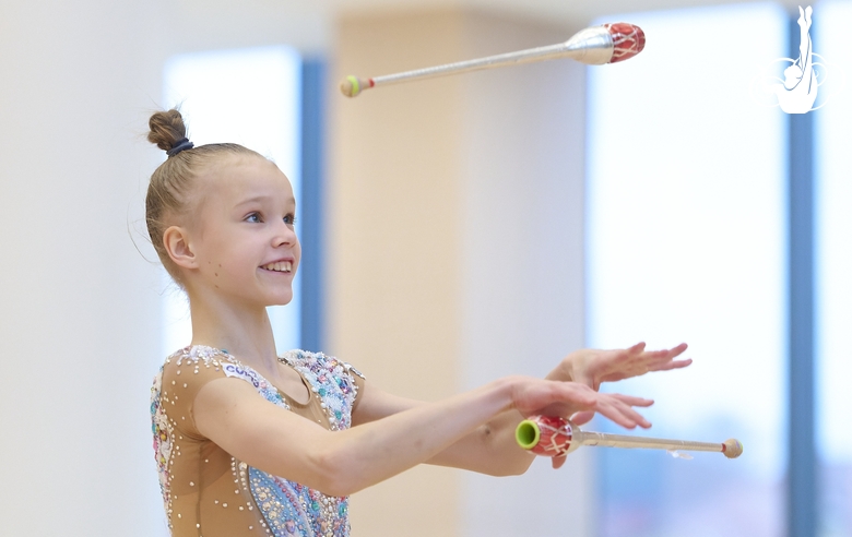 Kristina Voitenko during an exercise with clubs at a control training session