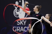 Gymnast during an exercise with a ribbon at floor testing