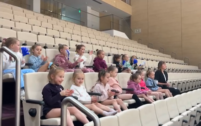 Young gymnasts support Masha Borisova, Anya Vakulenko and Sasha Borisova at the assessment training session