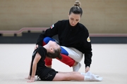 Academy coach Olga Frolova with a young gymnast during the selection process