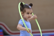 Young gymnast during an exercise with a hoop at the mAlinka tournament