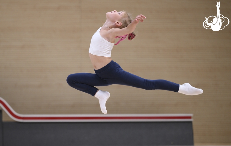 Young gymnast during training