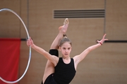 Gymnast during an exercise with a hoop during floor testing