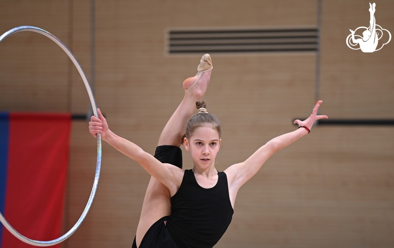 Gymnast during an exercise with a hoop during floor testing