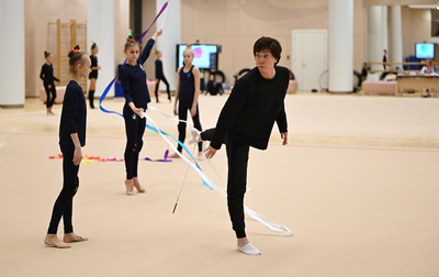 Irina Zenovka is creating a new program for the junior group gymnasts