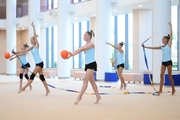 Gymnasts from the Khanty-Mansiysk Autonomous Okrug during an exercise with balls and ribbons