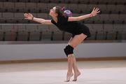 Gymnast during an exercise with a ball during floor testing