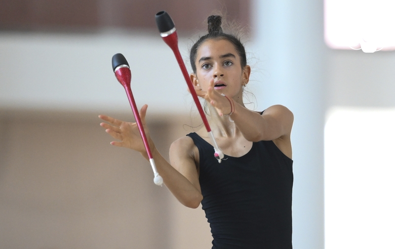 Anna Vakulenko during an exercise with clubs