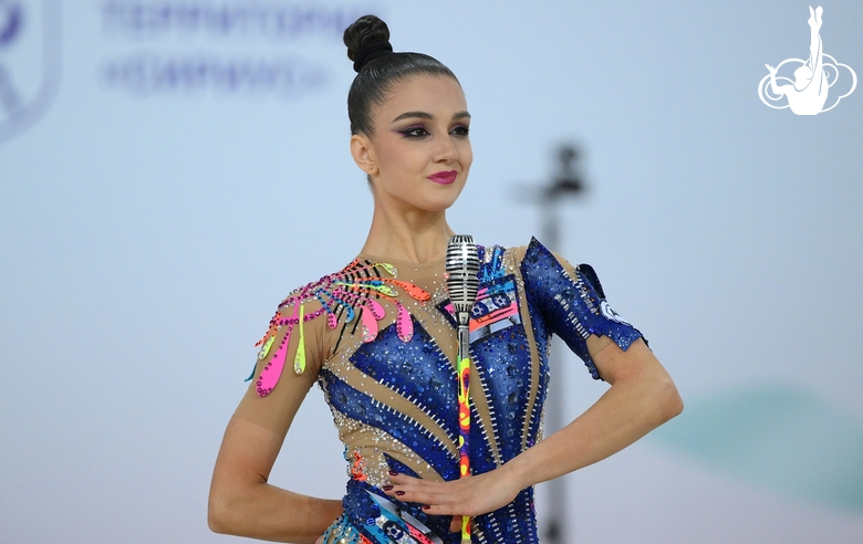 Arina Tkachuk during exercise with clubs