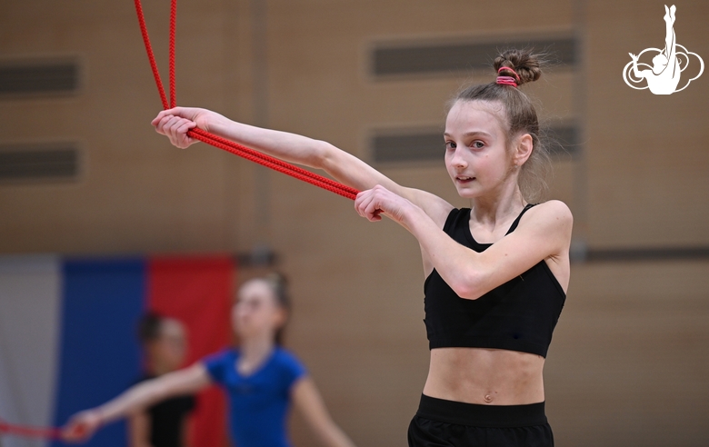 Gymnast during an exercise with a jump rope during floor testing