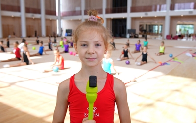 From which cities did the gymnasts come to the training camp at the Academy?