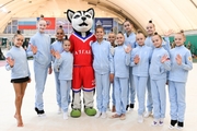 Academy students with the competition mascot