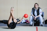 Ksenia Savinova with coach Evgenia Eliseeva during an exercise with a ball at warm-ups before the start of the tournament