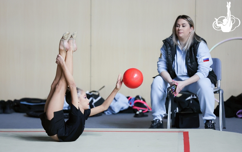 Ksenia Savinova with coach Evgenia Eliseeva during an exercise with a ball at warm-ups before the start of the tournament