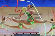 Gymnasts during an exercise with balls and ribbons