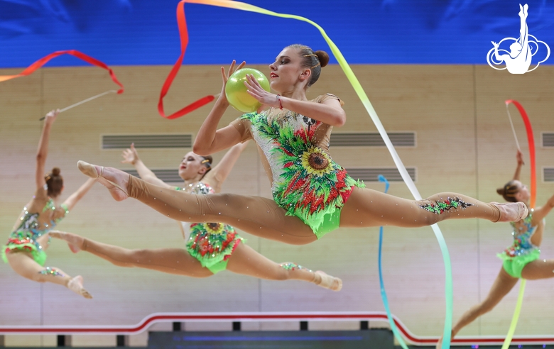 Gymnasts during an exercise with balls and ribbons