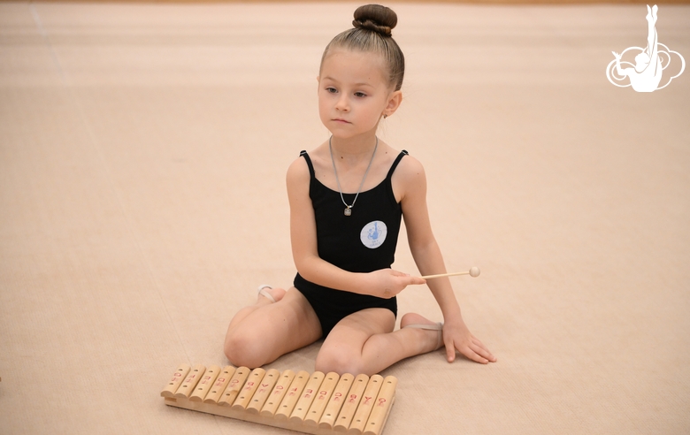 A young gymnast during a rhythmic gymnastics class