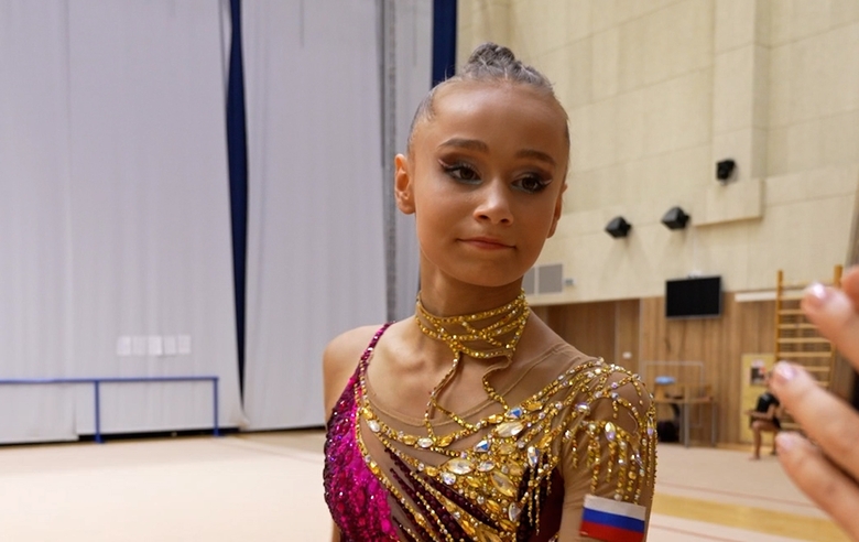 Olympic champion Alina Kabaeva works with Yana Zaikina to break down her ribbon routine, paying close attention to every detail of the program