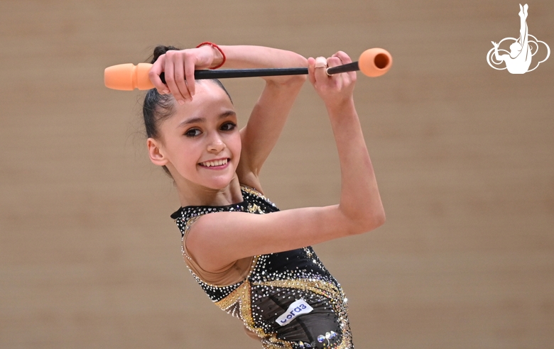 Valeria Medvedeva during an exercise with clubs at a control training session