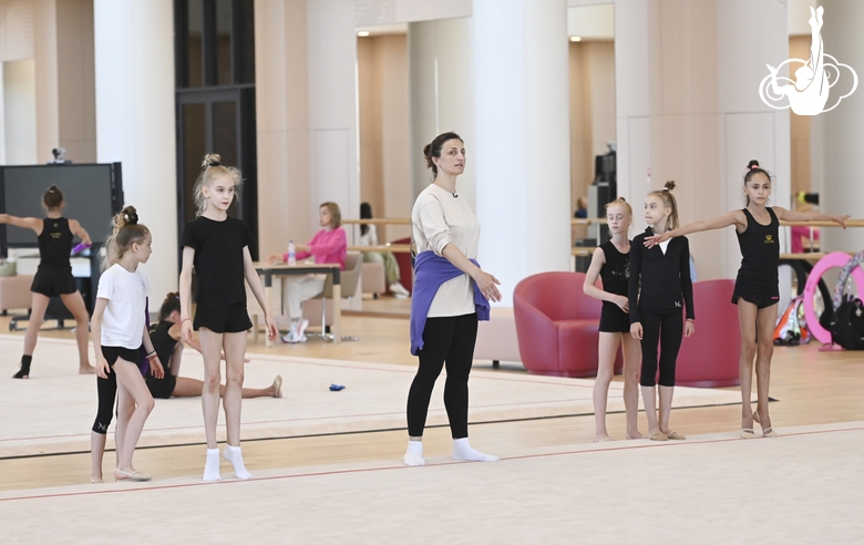 Academy coach Irina Dzyuba with gymnasts during class