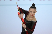 Arina Kovshova during exercise with clubs