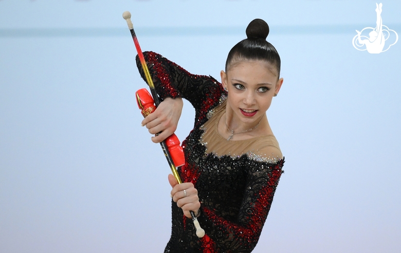 Arina Kovshova during exercise with clubs