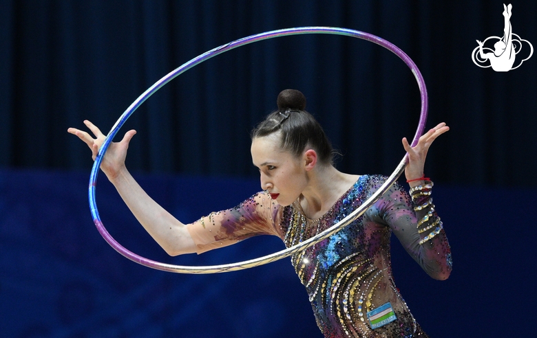 Takhmina Ikromova during an exercise with hoop