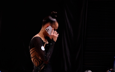 Alina Kabaeva supports Mariia Borisova before and after her clubs and ribbon routines in the all-around at the Cup of the Strongest final