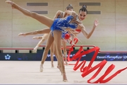 Gymnasts during an exercise with balls and ribbons