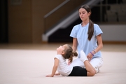 Academy coach Elizaveta Chernova with a young gymnast during the Academy selection process