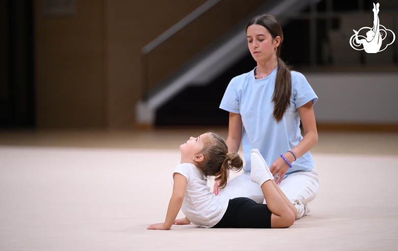 Academy coach Elizaveta Chernova with a young gymnast during the Academy selection process