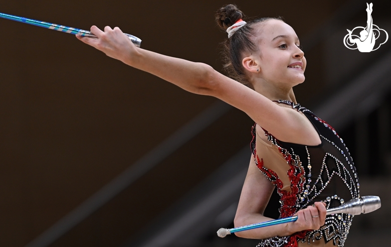 Miroslava Monina during an exercise with clubs at a control training session