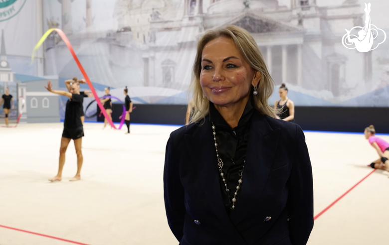 President of the St. Petersburg Rhythmic Gymnastics Federation Tatyana Kolesnikova assesses the performance of Masha and Sasha Borisova at the city championship