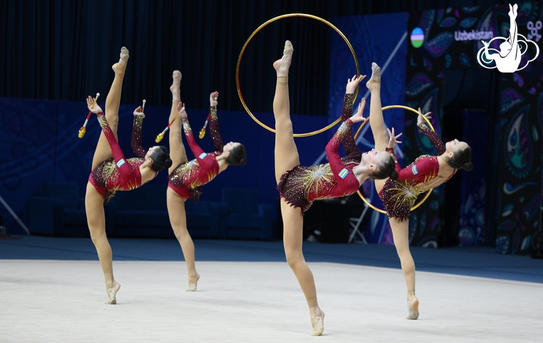 Team Uzbekistan during an exercise with hoops and clubs