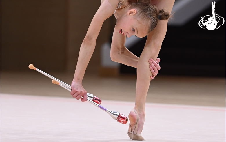 Kristina Voitenko during an exercise with clubs at the control training session