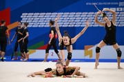 Gymnasts perform exercises with clubs during floor testing before the BRICS Games