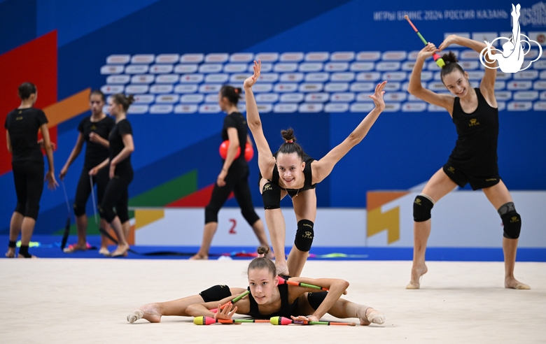 Gymnasts perform exercises with clubs during floor testing before the BRICS Games