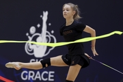 Gymnast during an exercise with a ribbon at floor testing