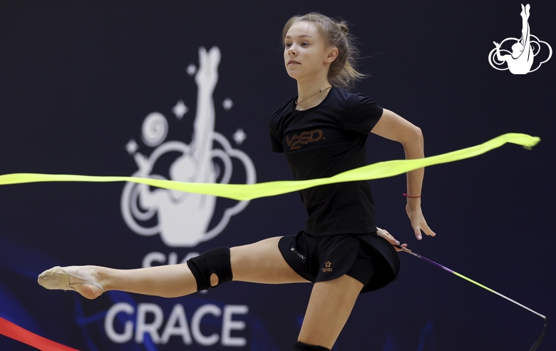 Gymnast during an exercise with a ribbon at floor testing