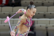 Gymnast during an exercise with clubs