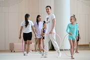 Choreographer Alexander Buklov with gymnasts from the Amur Tiger society during training