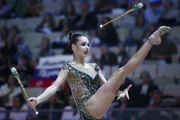 Anastasia Guzenkova (Russia) doing an exercise with clubs