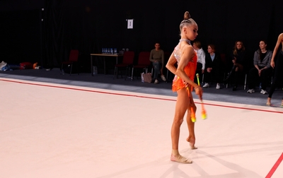 Alina Kabaeva together with coach Evgenia Eliseeva review the loss with the athlete