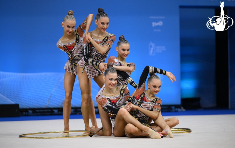 Academy group team during an exercise with hoops and clubs