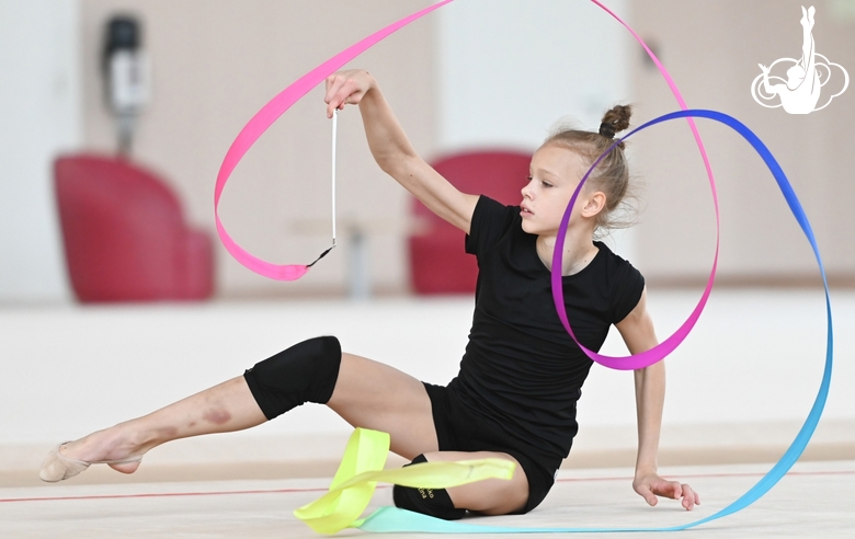 Kristina Voitenko working on a program with a ribbon