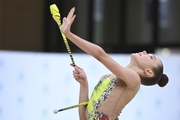 Gymnast during an exercise with clubs