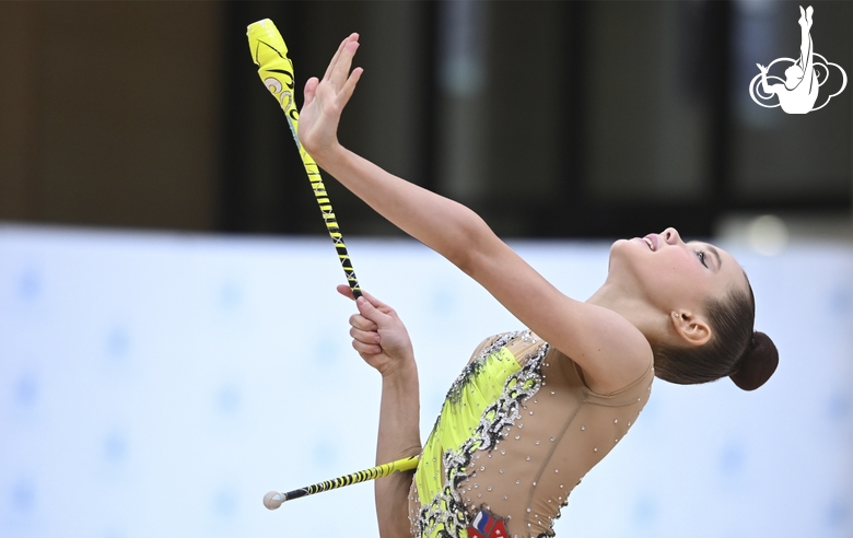 Gymnast during an exercise with clubs