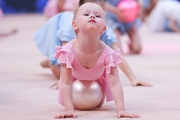 Young gymnast performing at the opening ceremony of the all-Russian Sky Grace Cup competition